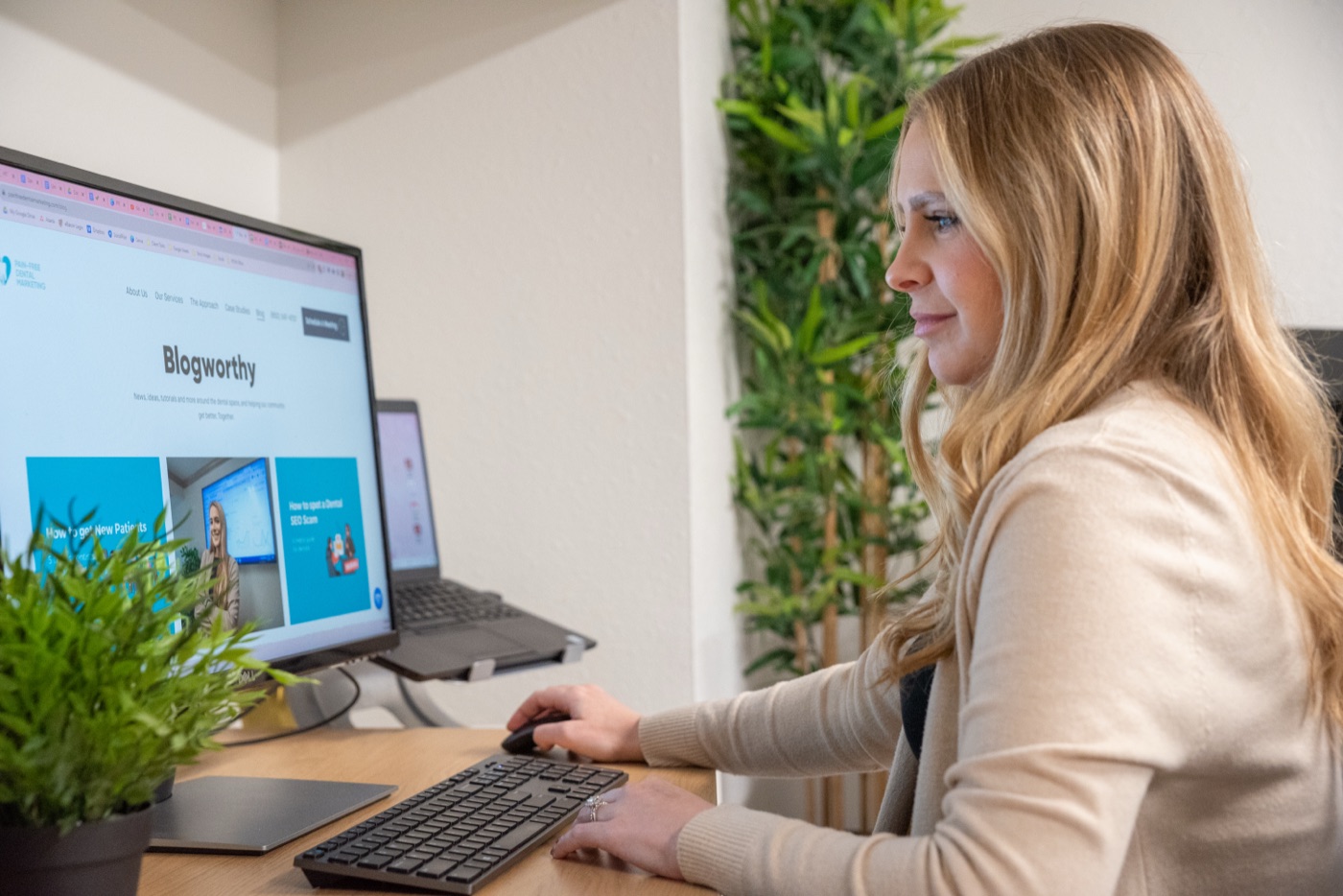 A person scanning a dental practice website on screen